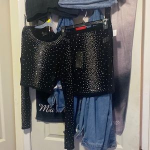 It’s a pretty black glittery skirt sets never been worn